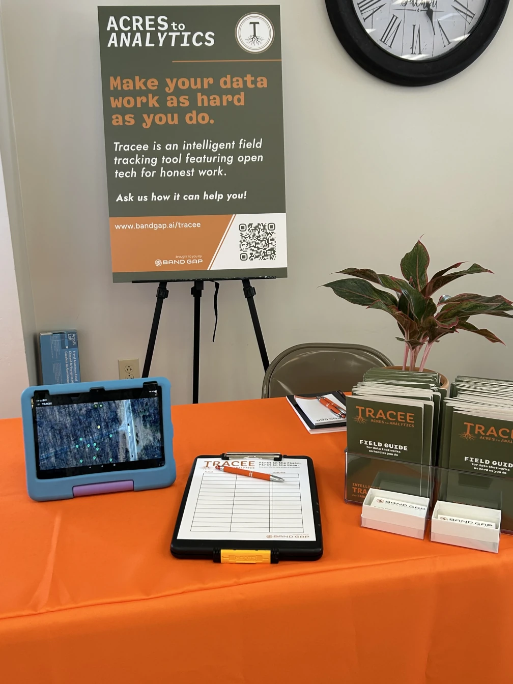 Tracee booth table with tablet and field guides